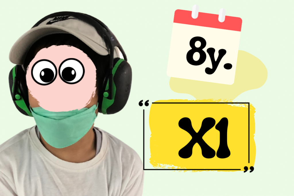 8歳のGeneがグリーンのイヤーマフを着用、マスクあり / Gene wearing green earmuffs and a mask at age 8 (X1)